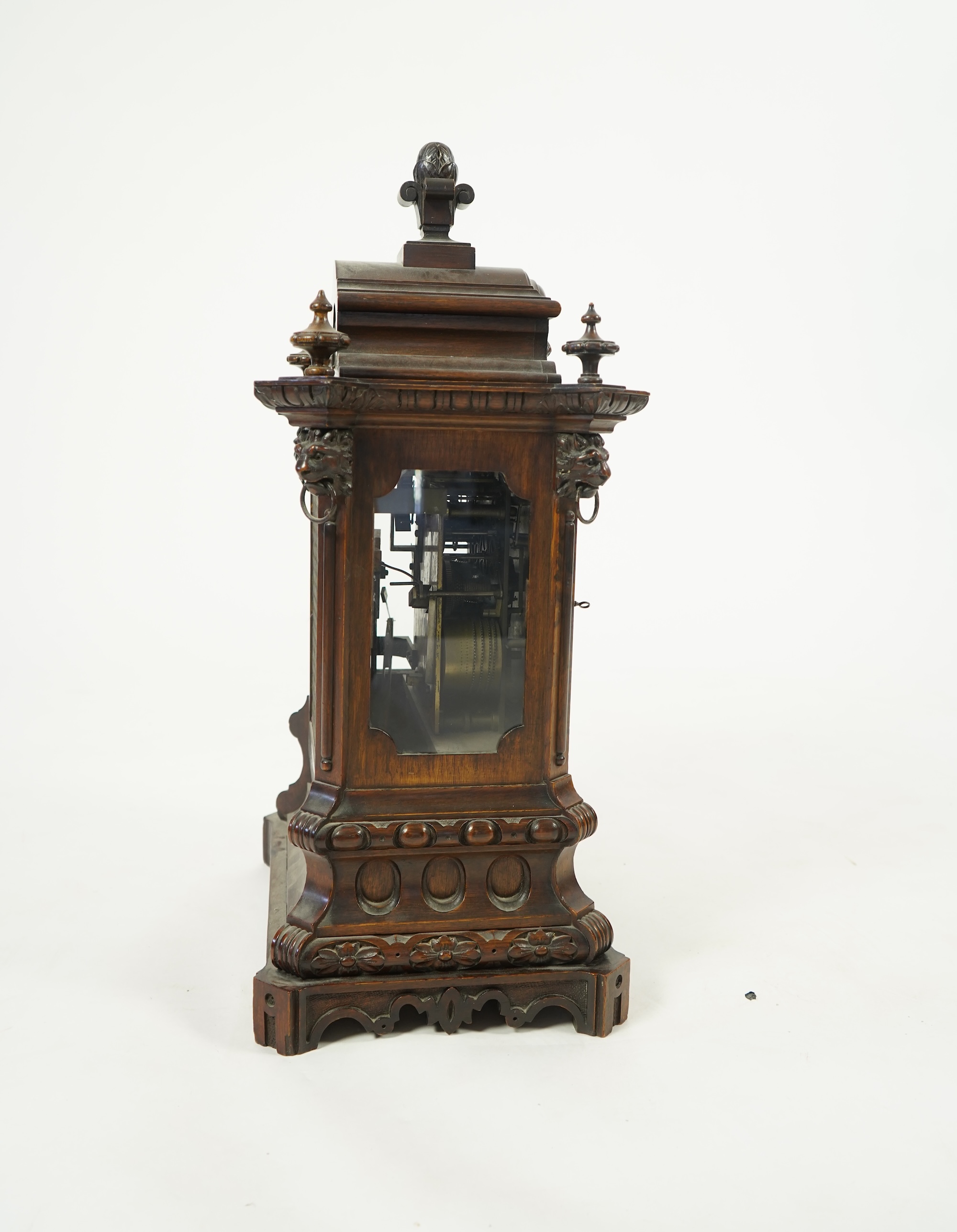 A late 19th century carved oak triple fusee bracket clock